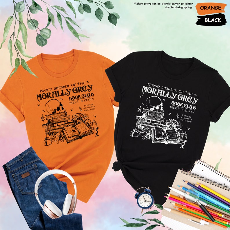 two t - shirts and headphones on a table