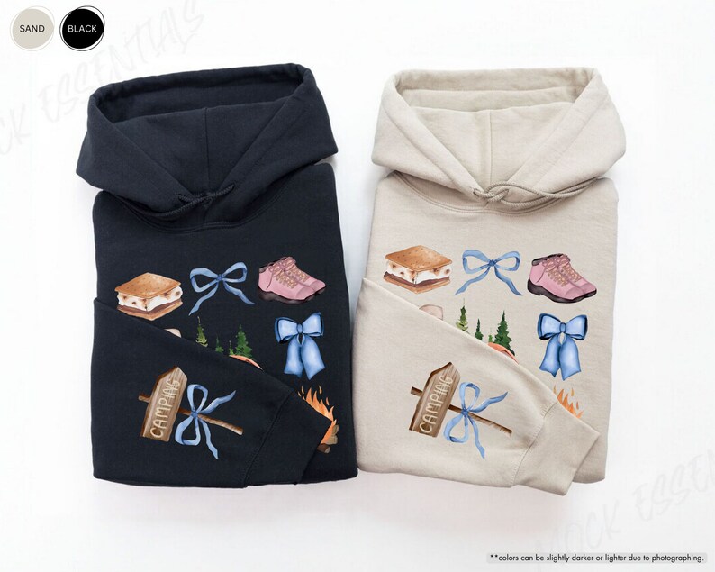 a couple of sweatshirts sitting on top of a white table
