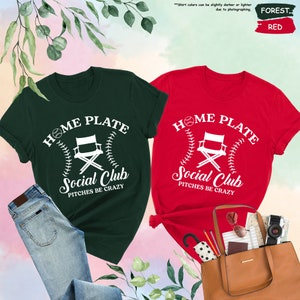 a couple of shirts that are next to a purse