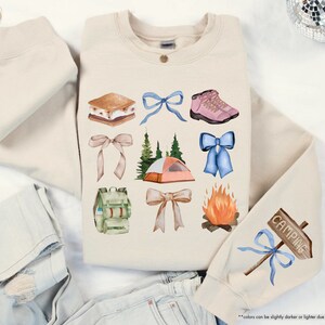 a pair of jeans, a sweater, and a pair of shoes are laid out