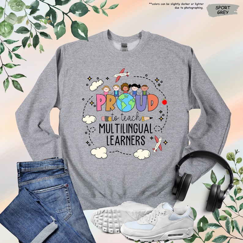 a sweatshirt with a pair of headphones next to it
