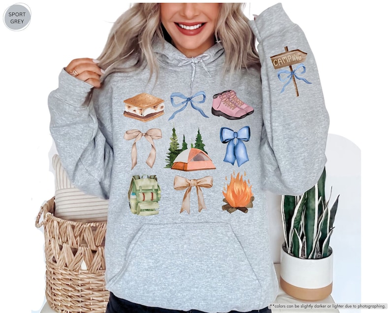 a woman wearing a hoodie with a bunch of things on it