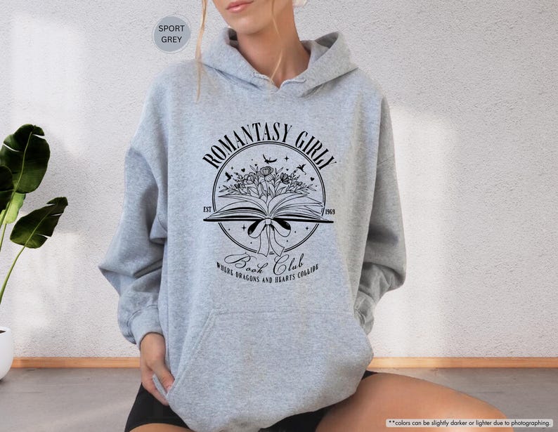 May include: A grey hooded sweatshirt with a black graphic design that says "Romantasy Girl" and "Book Club" with a book, flowers, and birds.