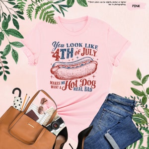 a pink shirt with a hot dog on it