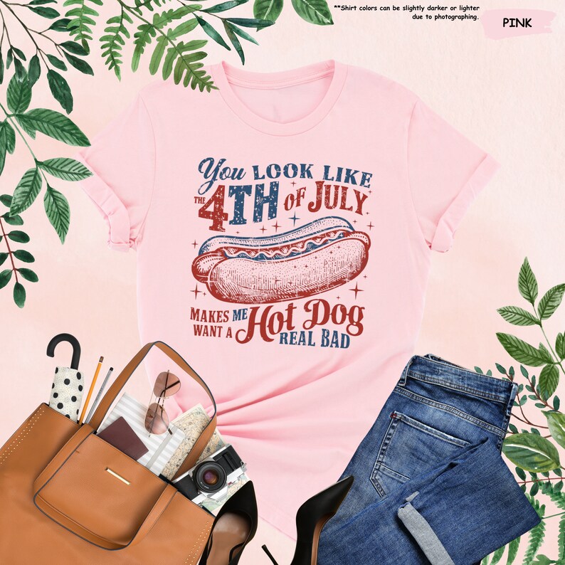 a pink shirt with a hot dog on it