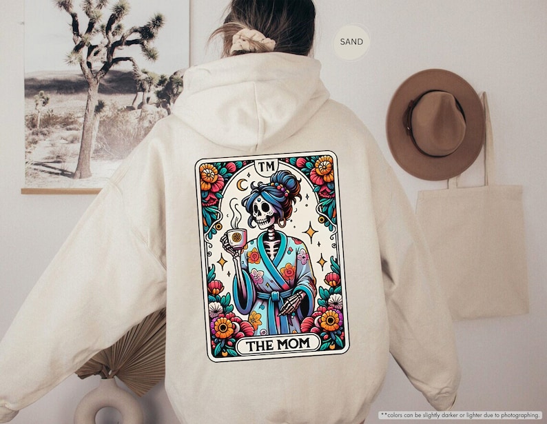 a person wearing a hoodie with a picture of a skeleton on it