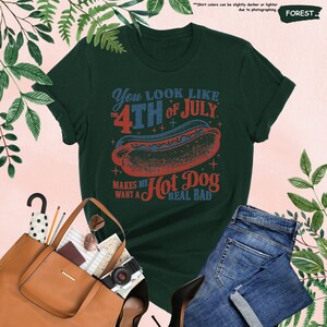 a green shirt with a hot dog on it