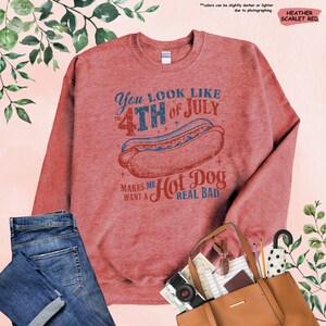 a red sweatshirt with a hot dog on it