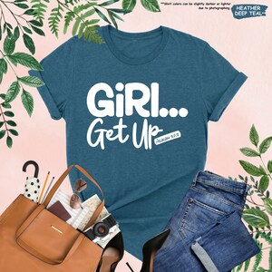 a t - shirt that says girl get up next to a pair of jeans and