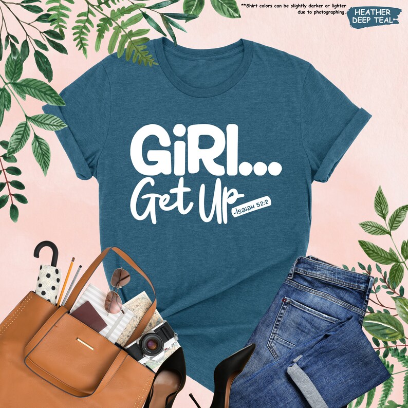 a t - shirt that says girl get up next to a pair of jeans and