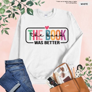 a white shirt with the words the book was better on it