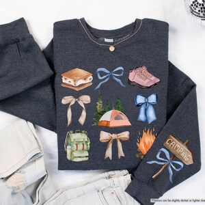 a pair of jeans and a sweater with patches on them