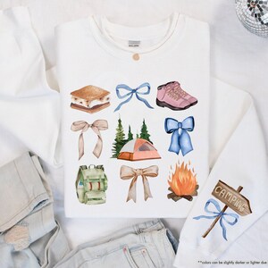 a white t - shirt with various items on it