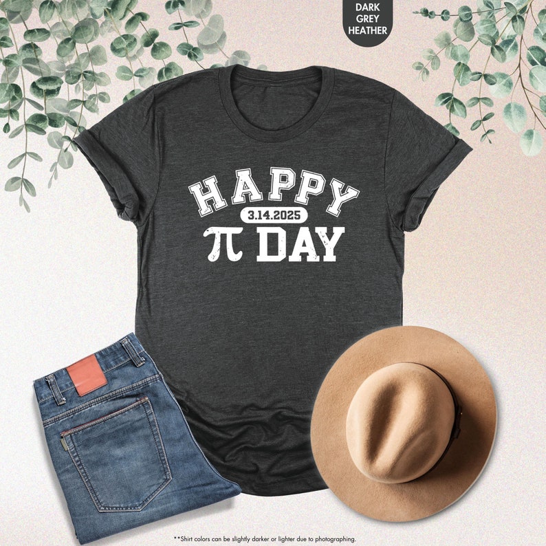 May include: A dark heather grey t-shirt with white text that reads "HAPPY 3.14.2025 &pi; DAY".
