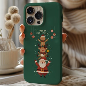 May include: Green phone case with a Christmas design featuring Santa Claus, a reindeer, and a gingerbread man. The text "Merry Christmas" is printed on the case.