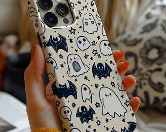 May include: A white phone case with a Halloween theme. The case is covered in a pattern of black bats, ghosts, and stars.