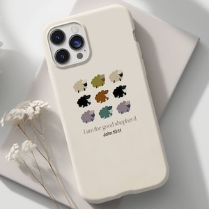 May include: A white iPhone case with a design of colorful sheep and the text "I am the good shepherd John 10:11".