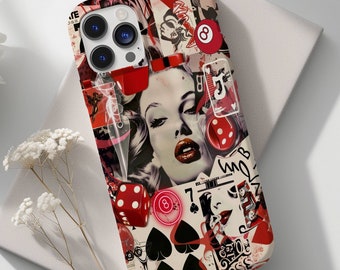 May include: A phone case with a collage design featuring a woman's face, playing cards, dice, and a red eight ball. The case has a black and white background with red, white, and black accents.