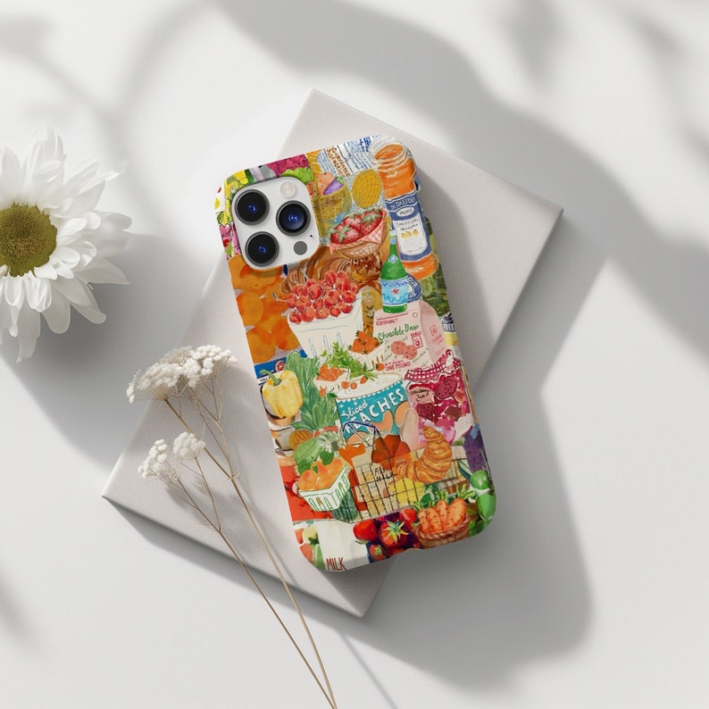 May include: A colorful phone case with a collage of food items, including fruit, vegetables, and bread. The case features a variety of colors, including red, orange, yellow, green, and blue. The case also features the text "Sliced Peaches" and "Milk".
