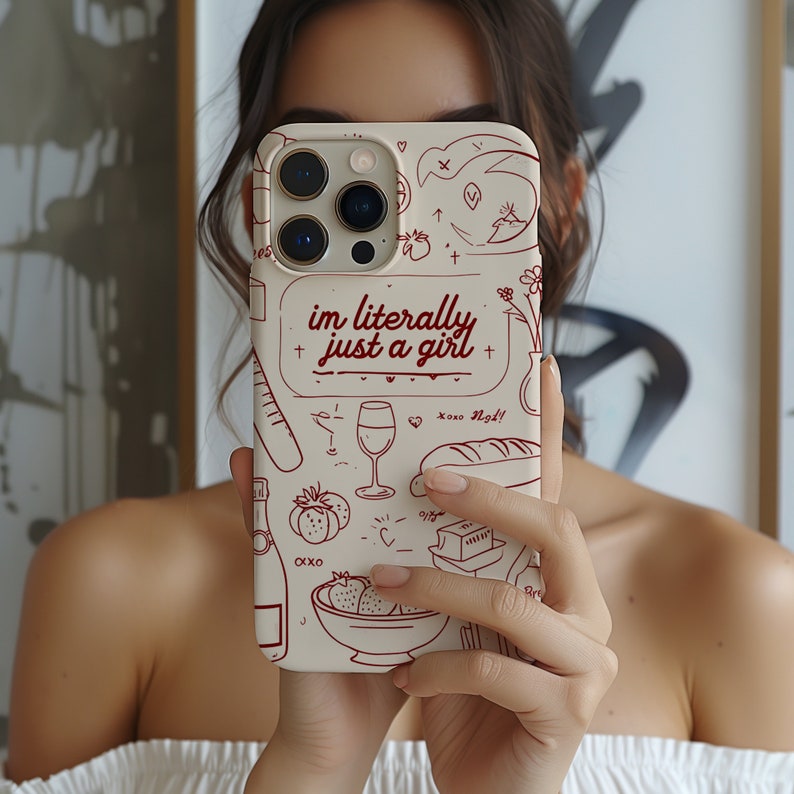 May include: A white phone case with a red outline of various drawings, including a glass of wine, a baguette, strawberries, and a bottle of champagne. The text "im literally just a girl" is written in red on the case.