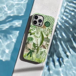 May include: A green and white phone case with a floral design featuring lilies of the valley, butterflies, and vintage stamps. The case has a camera lens cutout and a green background.