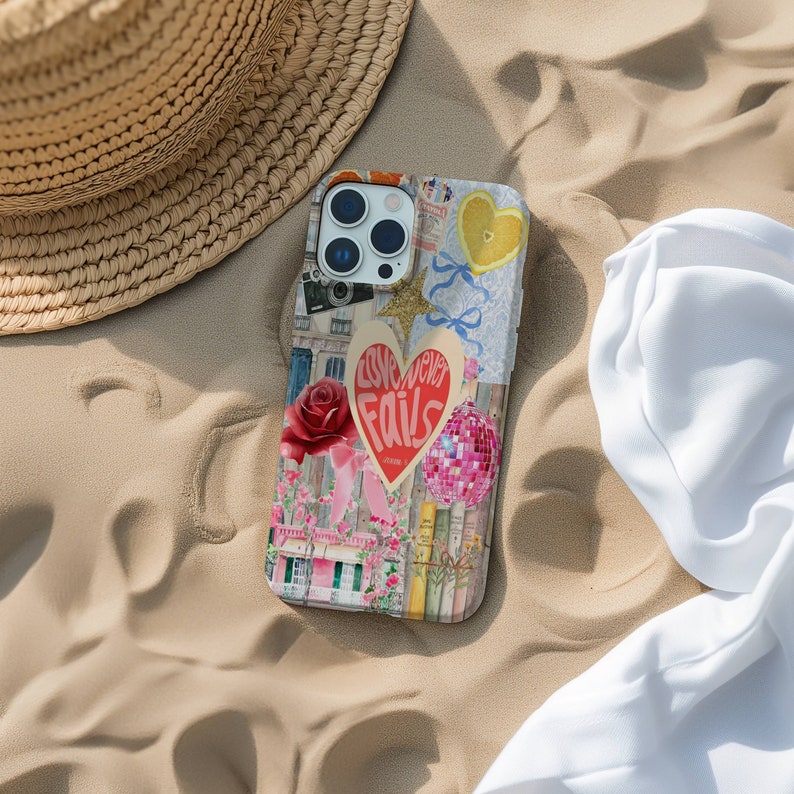 May include: A colorful phone case with a collage of images, including a heart with the text "Love never fails", a disco ball, a lemon, and a building with flowers.
