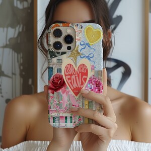 May include: A colorful phone case with a collage of images, including a heart with the text "Love never fails", a rose, a camera, and a lemon. The case is designed for an iPhone.