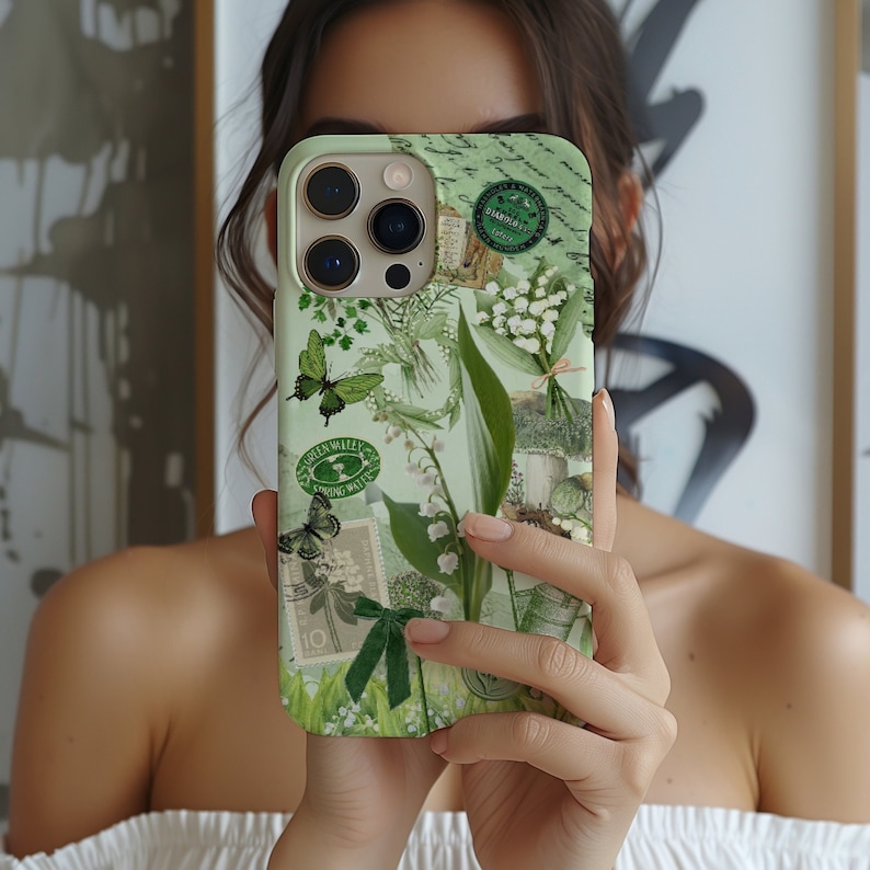 May include: A green and white phone case with a floral design and a butterfly. The case has a vintage aesthetic with a green and white floral pattern and a butterfly design. The case also has a green and white floral pattern and a butterfly design.