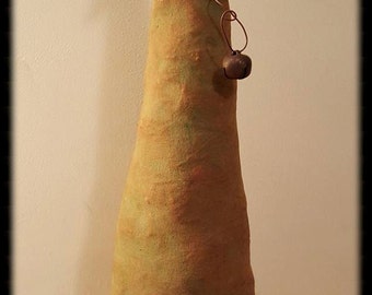 May include: A handmade primitive Christmas tree with a star on top and a bell hanging from a wire. The tree is made of fabric and has a brown base with the text "Peach Bottom Primitives" stitched on it.