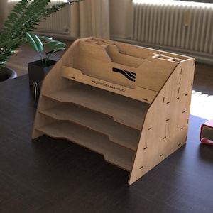 May include: A light-colored wooden table organizer with multiple shelves and compartments. The organizer has a curved design and includes a section for pens and pencils. The text "WOODEN TABLE ORGANIZER" is printed on the front.