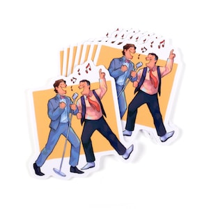 May include: A set of stickers featuring two cartoon men singing into microphones. The men are wearing suits and ties, and the background is a yellow-orange colour. There are musical notes above the men's heads.