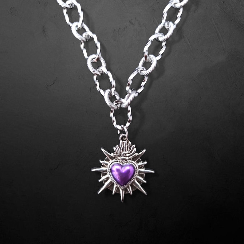 Our Thorn Heart Necklace, a stunning gothic necklace crafted with care and precision. This goth chain necklace features a striking black or red heart pendant wrapped in intricate thorn details, perfectly embodying alternative and edgy style.
Measuring approximately 16 inches in length with an Magnetic clasp. The pendant itself is compact yet bold, making a unique statement piece that enhances any gothic or punk-inspired outfit.