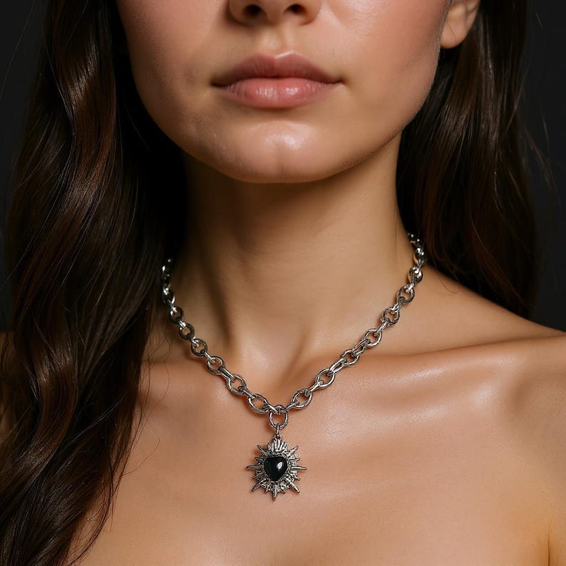 Our Thorn Heart Necklace, a stunning gothic necklace crafted with care and precision. This goth chain necklace features a striking black or red heart pendant wrapped in intricate thorn details, perfectly embodying alternative and edgy style.
Necklace length varies, strong magnetic clasp. The pendant itself is compact yet bold, making a unique statement piece that enhances any gothic or punk-inspired outfit.