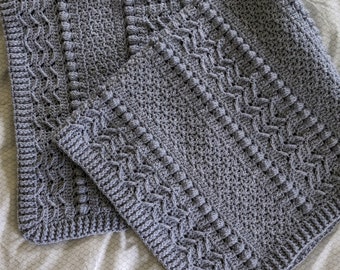 Manta de cochecito gris acogedor crochet texturizado