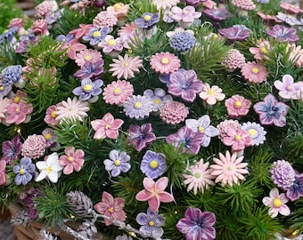 10 ceramic flowers, lovingly handcrafted and fired to be frost-resistant.