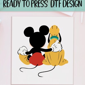 May include: A black and white illustration of Mickey Mouse and Pluto sitting side by side. Mickey is wearing red shorts and Pluto is wearing a green collar.