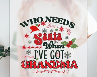 May include: White t-shirt with red and green Christmas-themed text that reads "Who needs Santa when I've got Grandma".