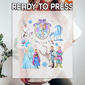May include: A white sublimation transfer featuring watercolor illustrations of characters from the movie Frozen. The design includes Elsa, Anna, Olaf, Kristoff, Sven, and a blue horse, with the text "LET IT GO" and "READY TO PRESS".
