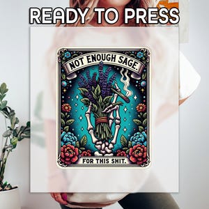 May include: A colorful graphic with the text "NOT ENOUGH SAGE. FOR THIS SHIT." features a skeleton hand holding a bouquet of lavender and a lit cigarette. The design is framed with flowers and stars, with the words "READY TO PRESS" at the top.