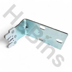 May include: A silver-colored metal corner bracket with a white plastic piece attached. The bracket has multiple holes and slots for screws. The white plastic piece has a series of curved slots. The bracket is designed to provide support and stability.