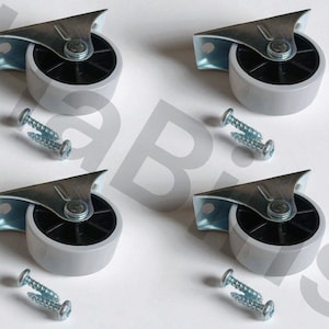 May include: Four gray swivel caster wheels with metal mounting plates and screws. Each wheel has a black center and a gray outer ring. The mounting plates are silver and have a triangular shape. The screws are silver.