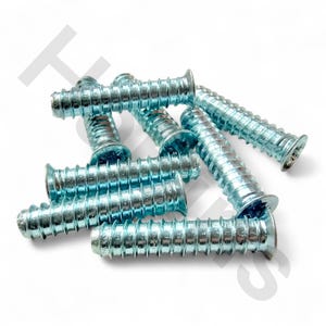 May include: A collection of silver-colored wood screws with a flat head and a threaded shaft. The screws are scattered across a white surface, showcasing their metallic sheen and spiral design. Ideal for woodworking and furniture assembly.