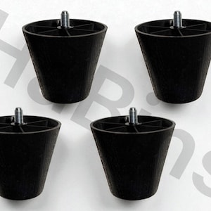 May include: Four black, cone-shaped furniture legs with a threaded metal bolt extending from the top. The legs are made of a textured plastic material and are designed for furniture support.