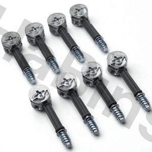 May include: An overhead shot of eight silver-colored cam lock fasteners. Each fastener has a circular head with a cross-shaped indentation, a black stem, and a threaded end. The fasteners are arranged diagonally on a white surface.