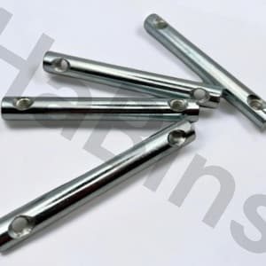 May include: Five silver metal rods, each with a cylindrical form and a hole at each end. The rods are arranged on a white surface, with some overlapping. These are likely for a mechanical or construction purpose.