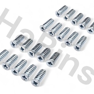 May include: A collection of silver screws with Phillips head slots. The screws are arranged in rows and columns against a white background. The screws are designed for use in woodworking or construction projects.