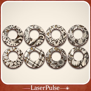 May include: Eight decorative wooden coasters with intricate designs. The coasters feature various patterns, including leaves, floral motifs, and plaid, in shades of brown and cream. The coasters are circular with a hole in the center.