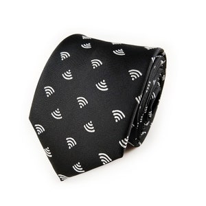 May include: A black necktie with a white wifi symbol pattern.