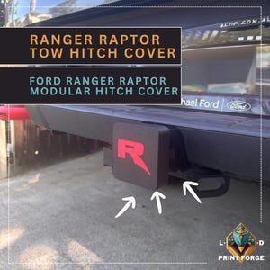 May include: A black tow hitch cover with a red "R" logo, designed for a Ford Ranger Raptor. The image also displays text that reads "RANGER RAPTOR TOW HITCH COVER" and "FORD RANGER RAPTOR MODULAR HITCH COVER."