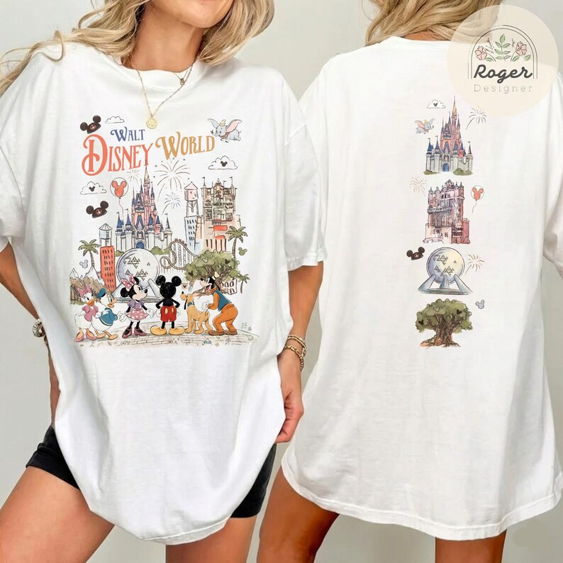 May include: A white t-shirt featuring a Walt Disney World graphic on the front with illustrations of Mickey Mouse, Minnie Mouse, Donald Duck, Daisy Duck, and Pluto. The back of the shirt displays a vertical arrangement of park landmarks.